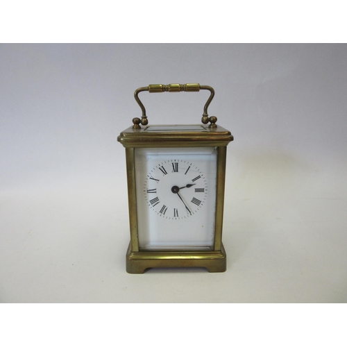 1328 - A 20th Century French carriage clock, brass cased, cracking to enamel face, 11cm high