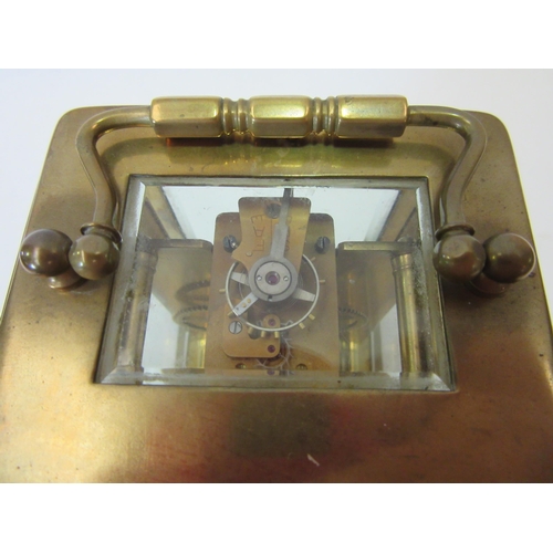 1328 - A 20th Century French carriage clock, brass cased, cracking to enamel face, 11cm high