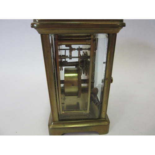 1328 - A 20th Century French carriage clock, brass cased, cracking to enamel face, 11cm high