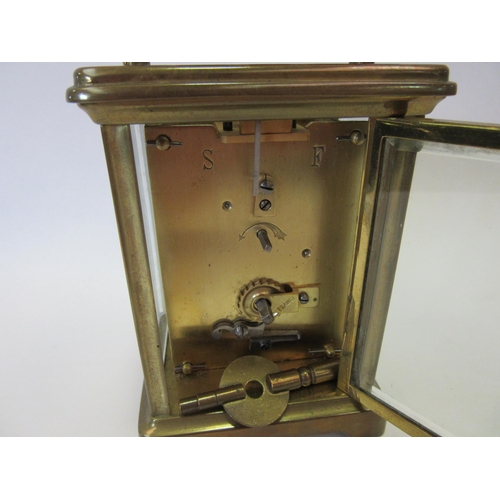 1328 - A 20th Century French carriage clock, brass cased, cracking to enamel face, 11cm high