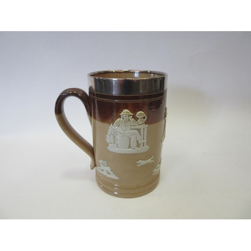 1329 - A Royal Doulton stoneware harvestware tankard with silver rim, 14cm high