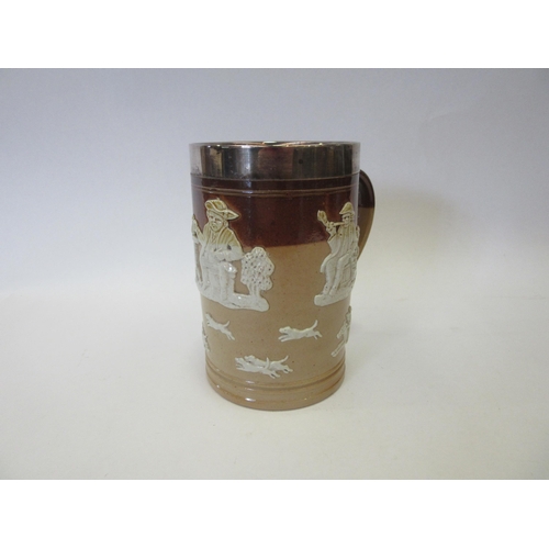 1329 - A Royal Doulton stoneware harvestware tankard with silver rim, 14cm high