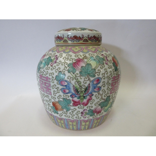 1336 - A Famille Rose ginger jar with flower and butterfly design, with lid having similar design of centra... 