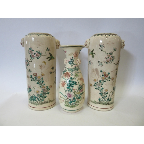 1338 - Three Japanese vases, cream ground with floral and wildlife decoration, two being a pair with inscri... 