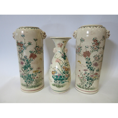 1338 - Three Japanese vases, cream ground with floral and wildlife decoration, two being a pair with inscri... 