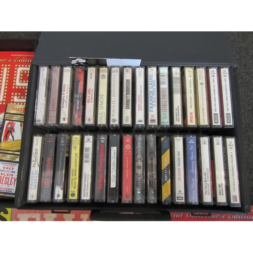 1352 - A vintage cassette case containing a collection of 32 cassettes including Freddie Mercury, Simply Re... 