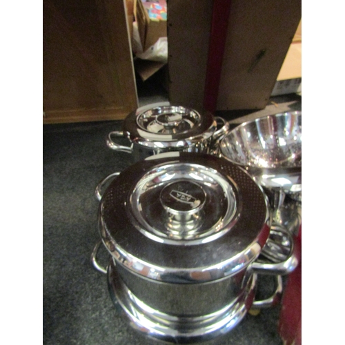 1030 - Four AGA lidded pans, a stainless steel colander and an Artame lidded cooking pot (6)