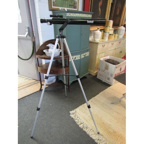 1074 - A Bushnell telescope on tripod with lenses and accessories