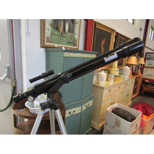 1074 - A Bushnell telescope on tripod with lenses and accessories