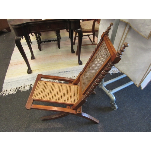 1087 - A bergere folding chair together with an Edwardian bedroom chair, inlaid with satinwood to back spla... 