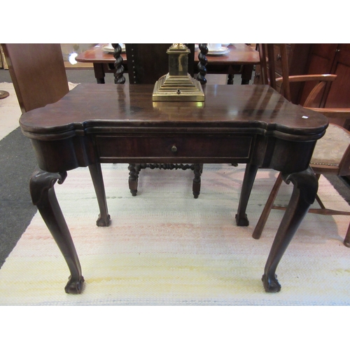 1089 - A Victorian mahogany games table on slender cabriole legs to ball and claw feet, a/f to top