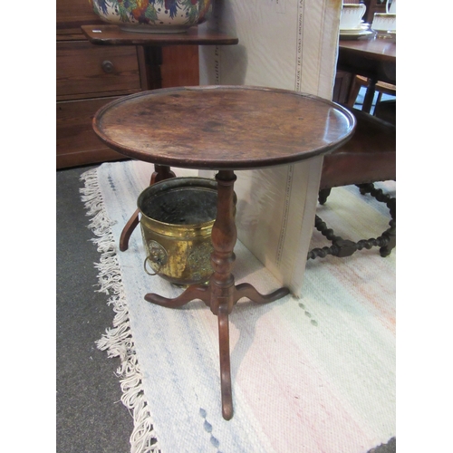 1094 - A George III carved oak tripod table, 65cm tall x 49cm diameter