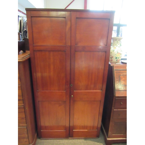 1103 - A late George III mahogany floor-standing cupboard with two solid panel doors enclosing adjustable s... 