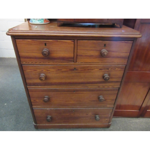 1107 - A Victorian pitch pine straight front chest of two short over three long graduated drawers, on a pli... 