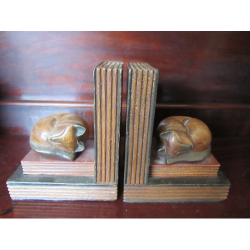 1112 - A pair of wooden book-ends as cats curled up on books, 17cm tall