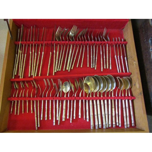 1124 - A nickel bronze canteen of cutlery with bamboo design handles