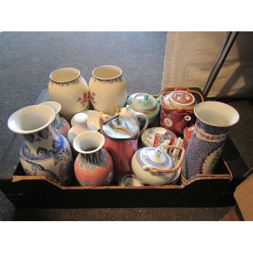 1132 - A box of ceramics including Chinese teapots, assorted vases, etc.