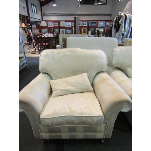 1139 - A pair of modern armchairs with scroll arms and wavy backs, brass castors to fore legs, stained and ... 