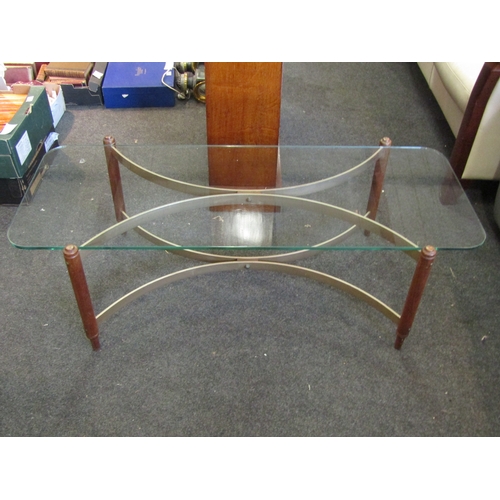 1140 - A mid-20th Century coffee table, glass top on curved base, 37cm tall x 117cm long x 46cm wide