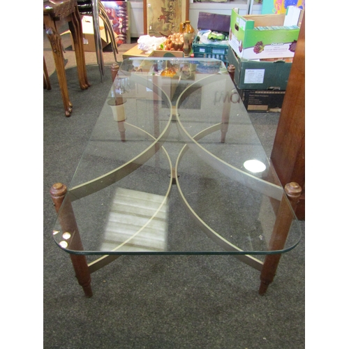 1140 - A mid-20th Century coffee table, glass top on curved base, 37cm tall x 117cm long x 46cm wide