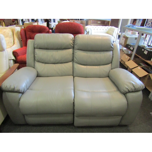 1142 - A grey leather two seater recliner sofa