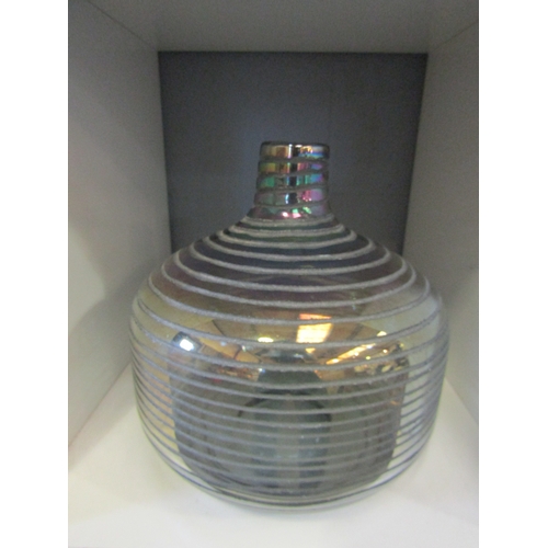 1270 - An iridescent bulbous body vase with spiral design, approximately 23cm tall