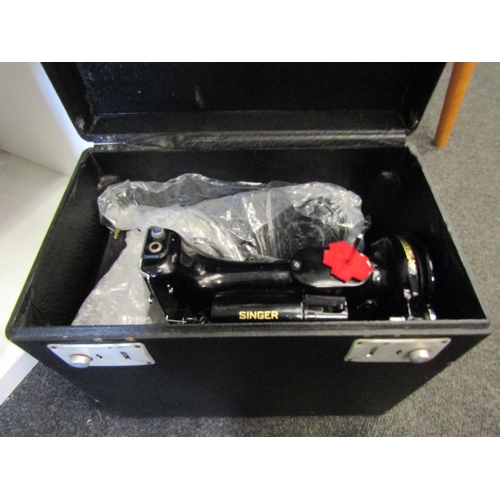 1279 - A Singer Featherweight sewing machine, cased with accessories