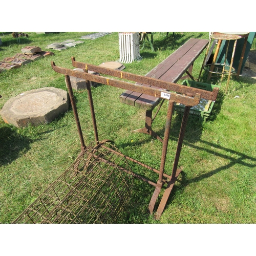 8034 - A pair of iron trestles