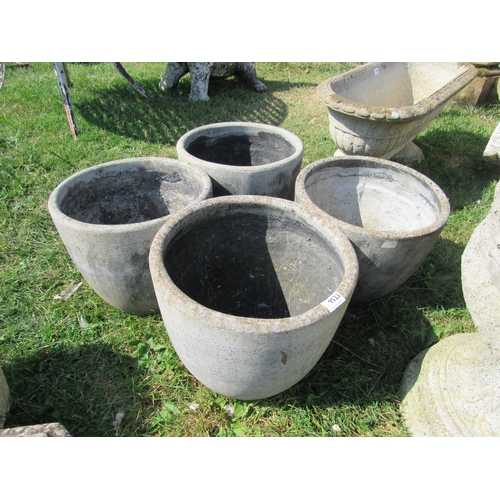 8048 - A set of four composition garden pots, 13