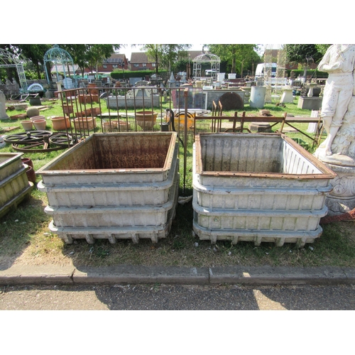 8010 - A pair of galvanised munitions factory water tanks, 37