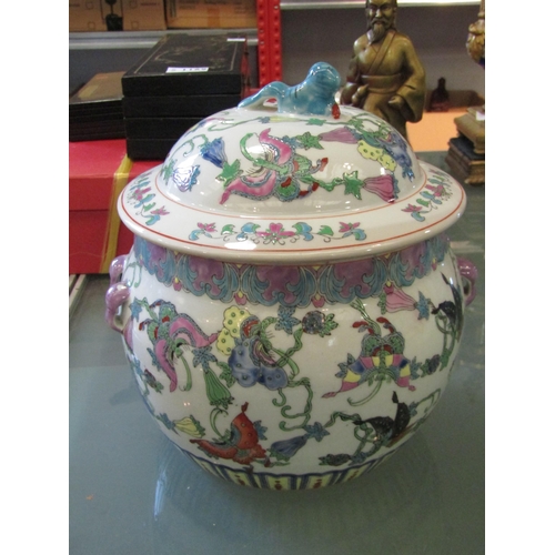 1168 - A 20th Century Chinese lidded pot with flower and butterfly design, purple glazed handles to sides, ... 