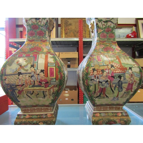 1172 - A pair of Chinese Canton porcelain Famille Rose vases on stands, floral and gilt decoration with pan... 