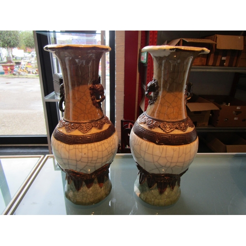 1177 - A pair of Chinese lion mask handled vases, A/F extensive repairs to rims and base, brown square char... 