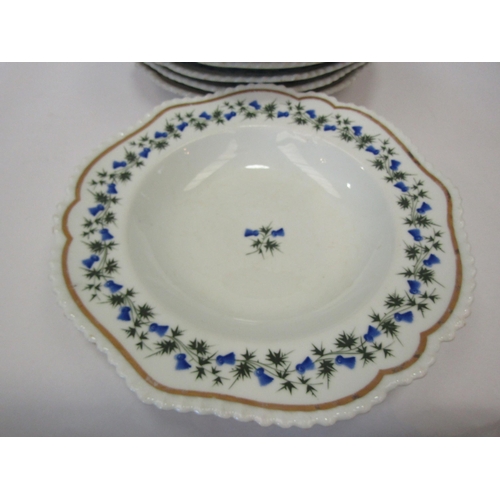 1387 - A set of early 19th Century Chamberlains plates and bowls decorated with blue flowers, four of each ... 