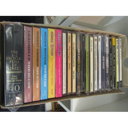 1406 - A box of 21 Jazz and Blues CD's including Miles Davis, Robert Johnson, Leadbelly, etc.