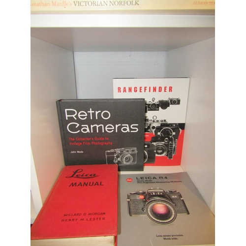 1410 - Four books on cameras and photography including Leica Manual 1947, plus others that are Leica relate... 