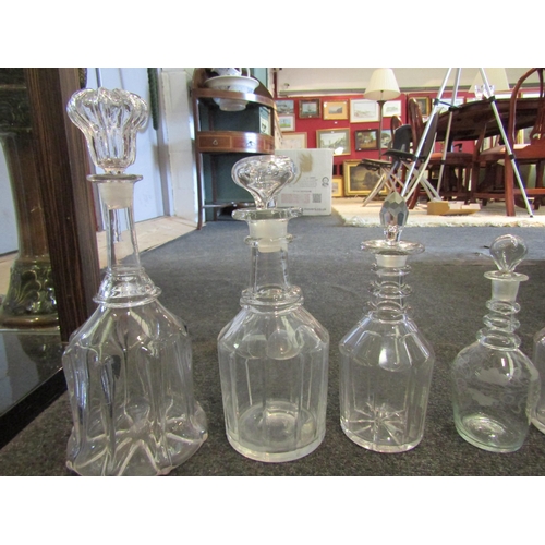 1454 - A collection of seven glass decanters including etched example, tallest 34cm (7)