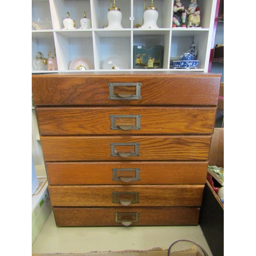 1464 - An early 20th Century collector's table-top chest of six oak-fronted drawers, containing sea shells