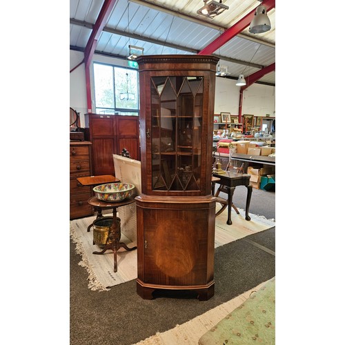 1016 - A reproduction corner cabinet with glazed top and cupboard door on bracket feet, 182cm tall x 63cm w... 