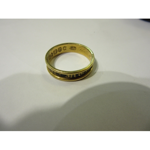 4366 - An 18ct gold memoriam ring