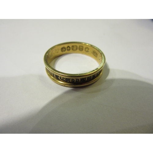 4366 - An 18ct gold memoriam ring