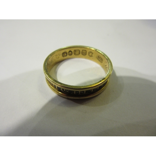 4366 - An 18ct gold memoriam ring