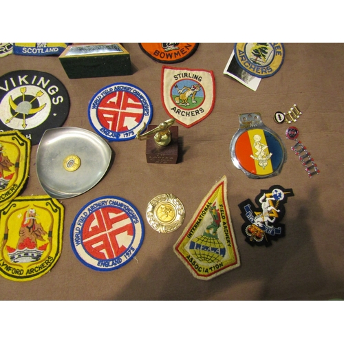 4432 - A box of archery medals, trophies and patches etc.