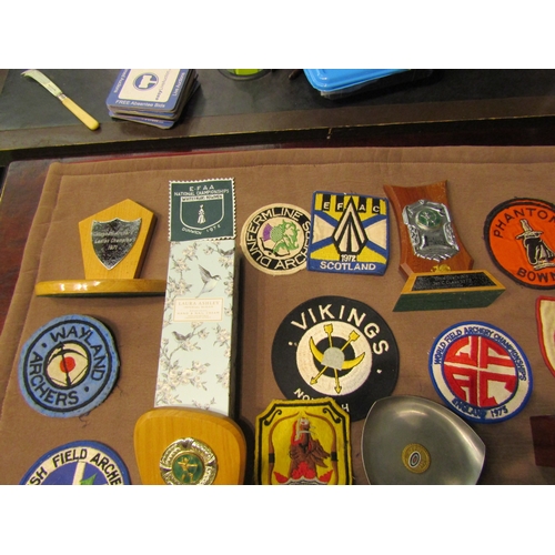 4432 - A box of archery medals, trophies and patches etc.