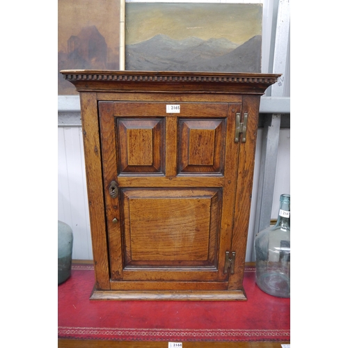 2162 - An 18th Century stripped panelled oak wall cupboard