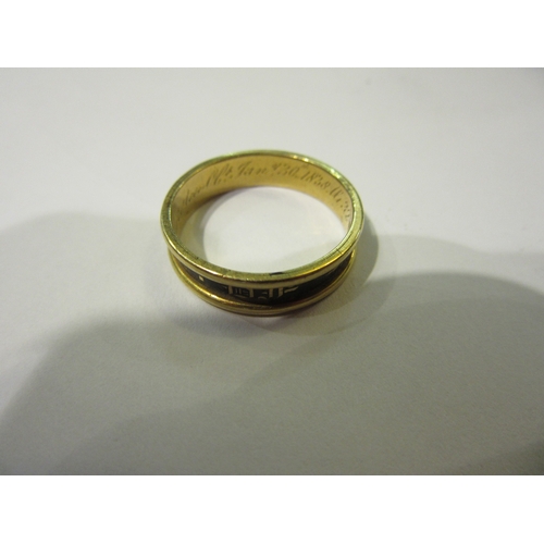 4366 - An 18ct gold memoriam ring