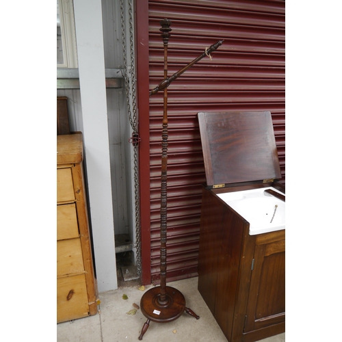 2180 - An Arts and Crafts walnut lamp standard