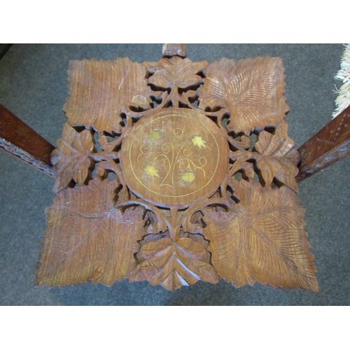 1083 - An Indian leaf-carved and brass inlaid three tier cake stand