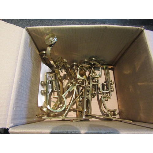 1436 - Ten brass adjustable curtain rail mounts, with screws housed in envelope