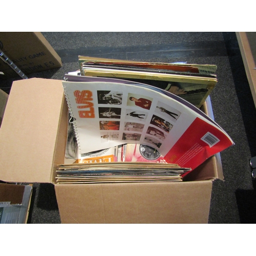 1437 - A box of Elvis Presley memorabilia including vinyls, singles, Elvis Monthly magazines, books, Elvis ... 